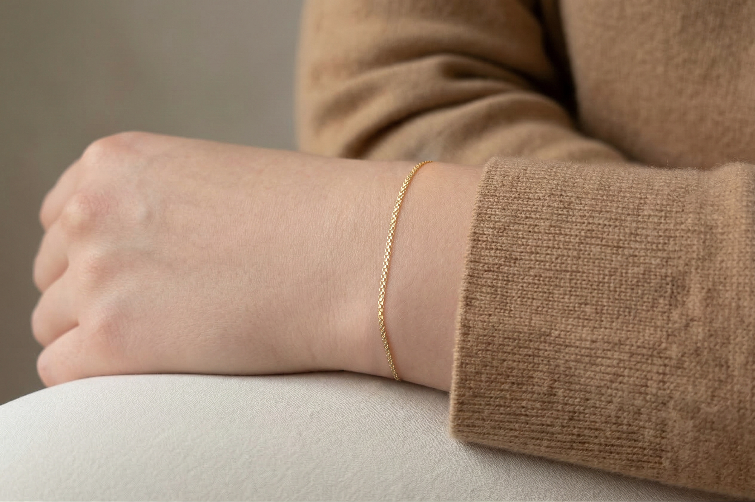 Thin 18K gold x-link bracelet on model, real gold women's jewelry