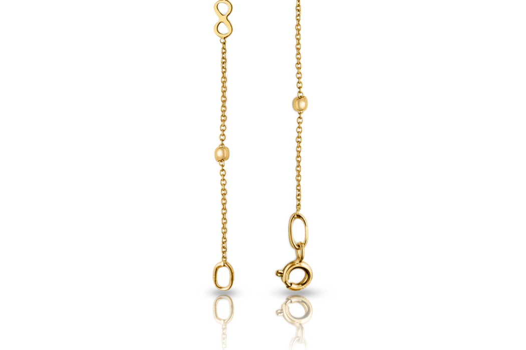 18K gold anchor chain bracelet with infinity symbol and ball beads with spring ring clasp, close-up real gold women's jewelry