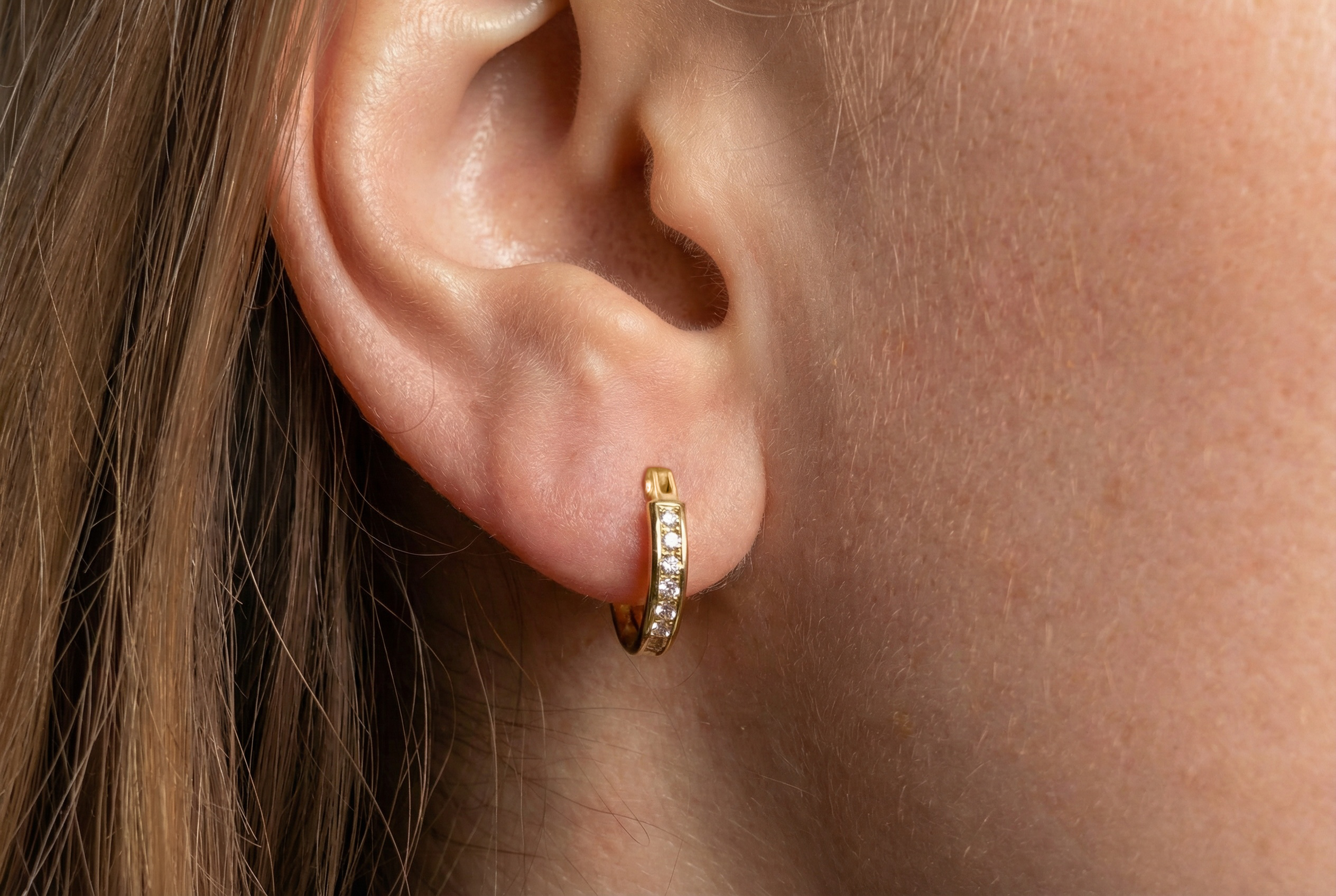 Gold earrings hoops with channel-set zirconia 18k